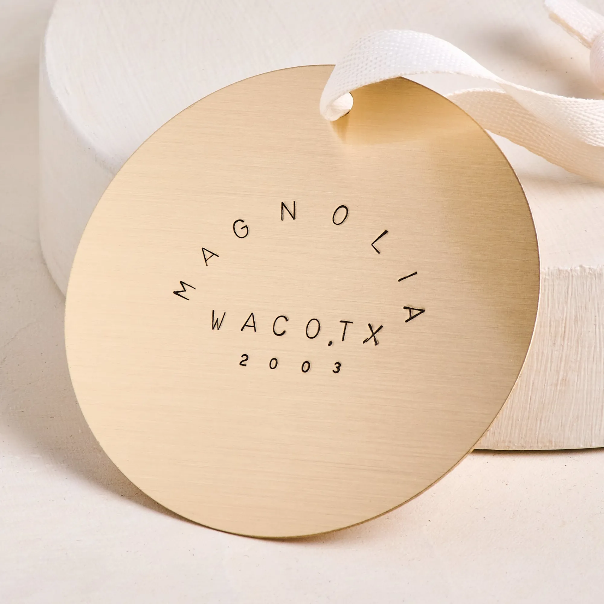 VND7297 Our Spare Change Magnolia Waco TX Brass Ornament